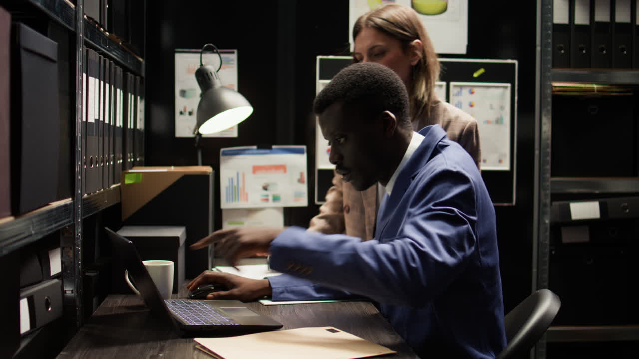 Business Colleagues Analyzing Data in Office