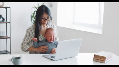 working mom with crying baby