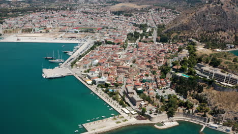 panoramic view of peloponnese old town cityscape, nafplion city, greece - aerial drone shot