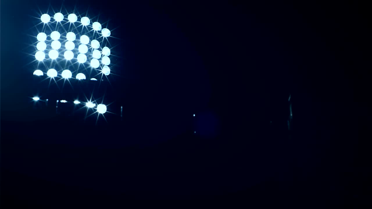 Background of football/soccer/sports stadium lights agains dark sky, 4k