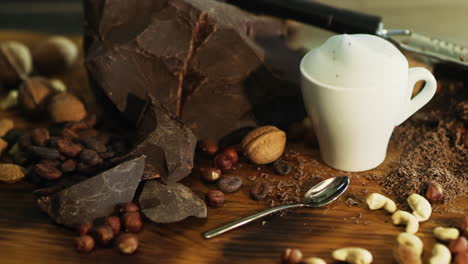 white cup of coffee with whipped cream and chocolate chips staying on table