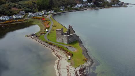 aerial view of lochranza castle on the isle of arran on an overcast day, scotland