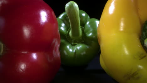 red, green and yellow bell peppers in a macro shot