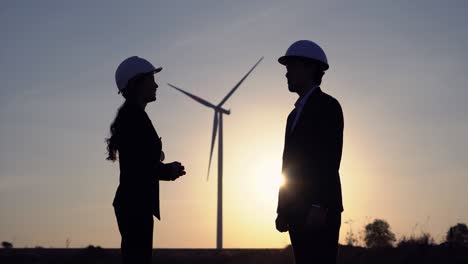 business men and women shake hands business deal,  turbine wind clean anergy.