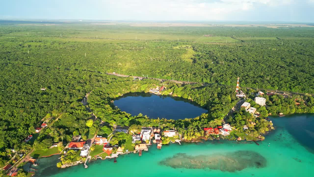 Aerial view of Bacalar's turquoise waters and lush greenery, serene and vibrant