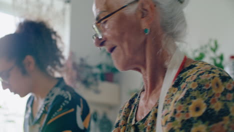 elderly grandma preparing dough as cooking with grandson in kitchen