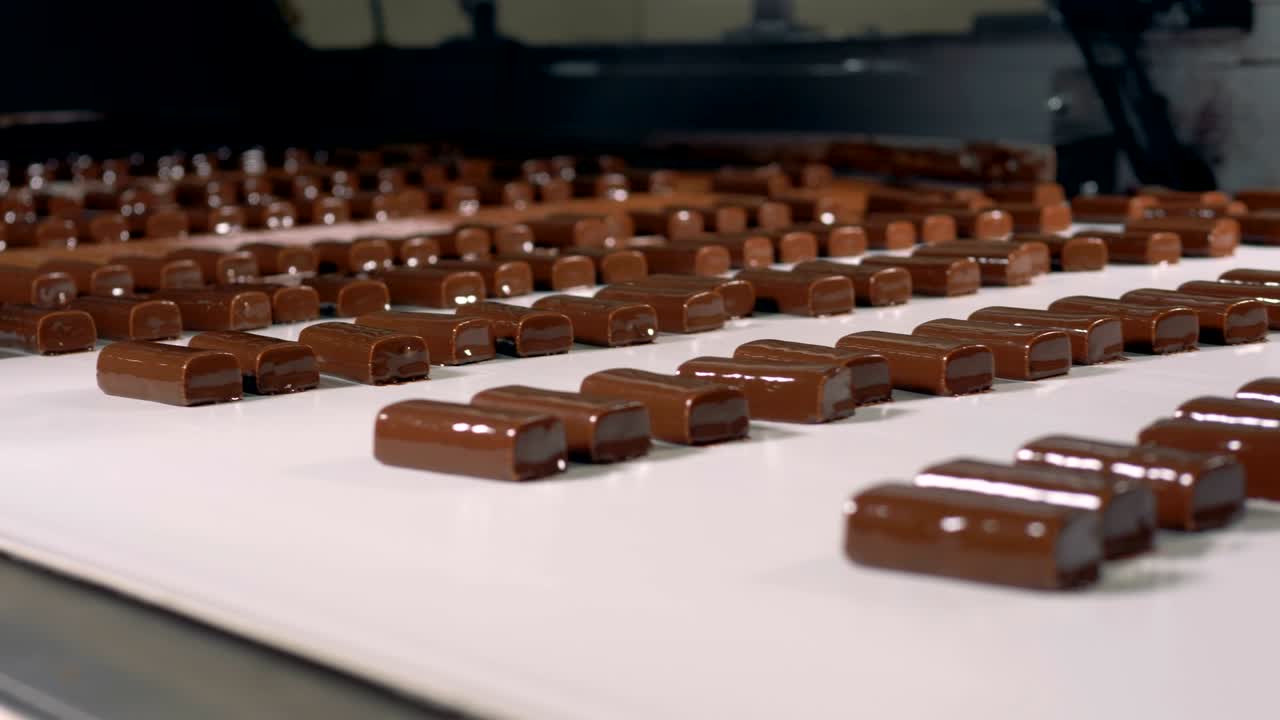 Chocolate sweets production process at confectionery shop.