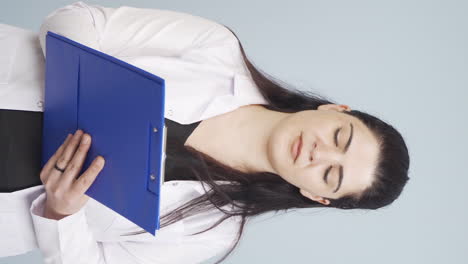 Vertical-video-of-Psychiatrist-doctor-taking-notes.