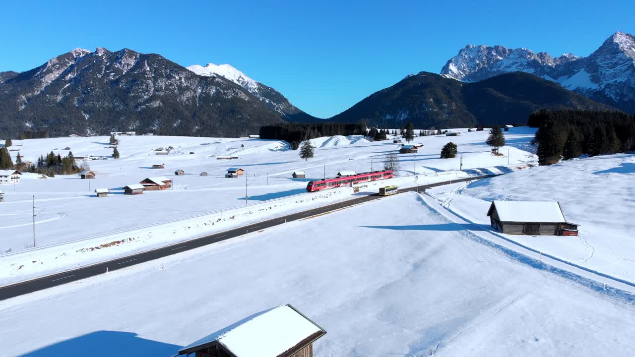 Aerial: train near Mittenwald with the Karwendel mountains as a background