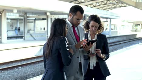group of business colleagues with digital tablet