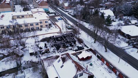 fire-burned-house-in-village,-winter-Snow