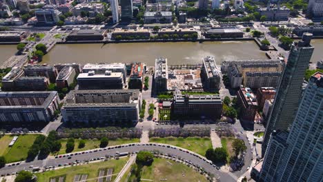 panning up drone shot of buenos aires, argentina from puerto madero on a clear, sunny day