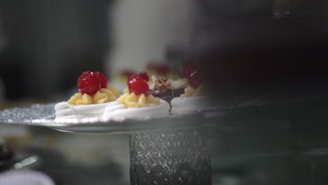 sweet treat meringue decorated with confined cherry, wedding dessert