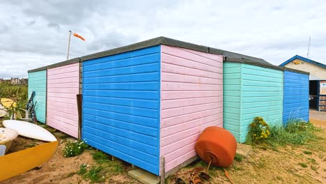 vibrant sheds and boats by the coastline