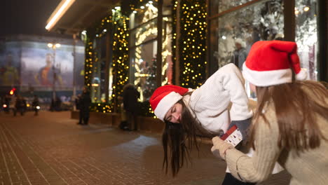 two girls having fun at christmas time