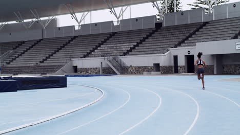 female runner training on a track