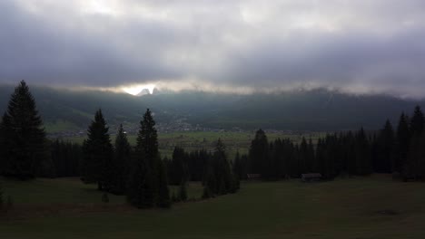 low cloud hangs over the valley as the sun tries to break through