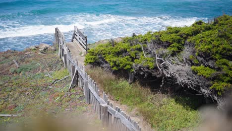 old wooden stairs leading over a cliff