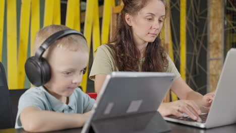 mother and son studying together