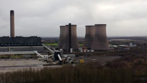 aerial view over coal fired power station smokestack site, fiddlers ferry overcast skyline