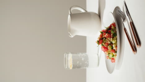 fresh salad with water and jug
