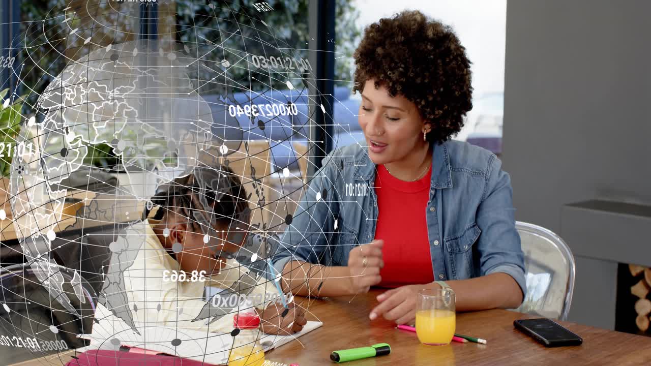 Child starting writing at table, adult leaning in pointing, globe appearing near child for learning