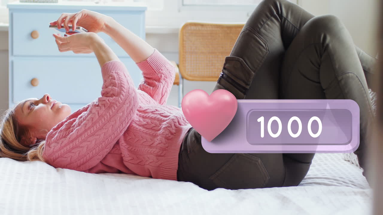 ⁇ 드폰 4k를 타이핑하는 동안 침대에 누워있는 여자