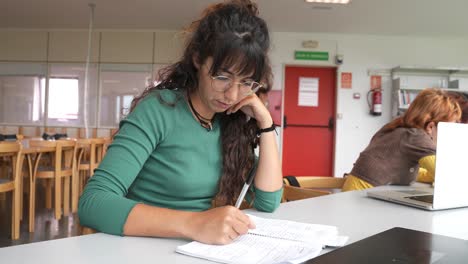 Young-women-working-on-project-in-library