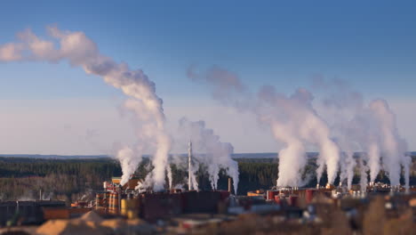 plumes of hazardous smoke rising from factory chimneys, climate change