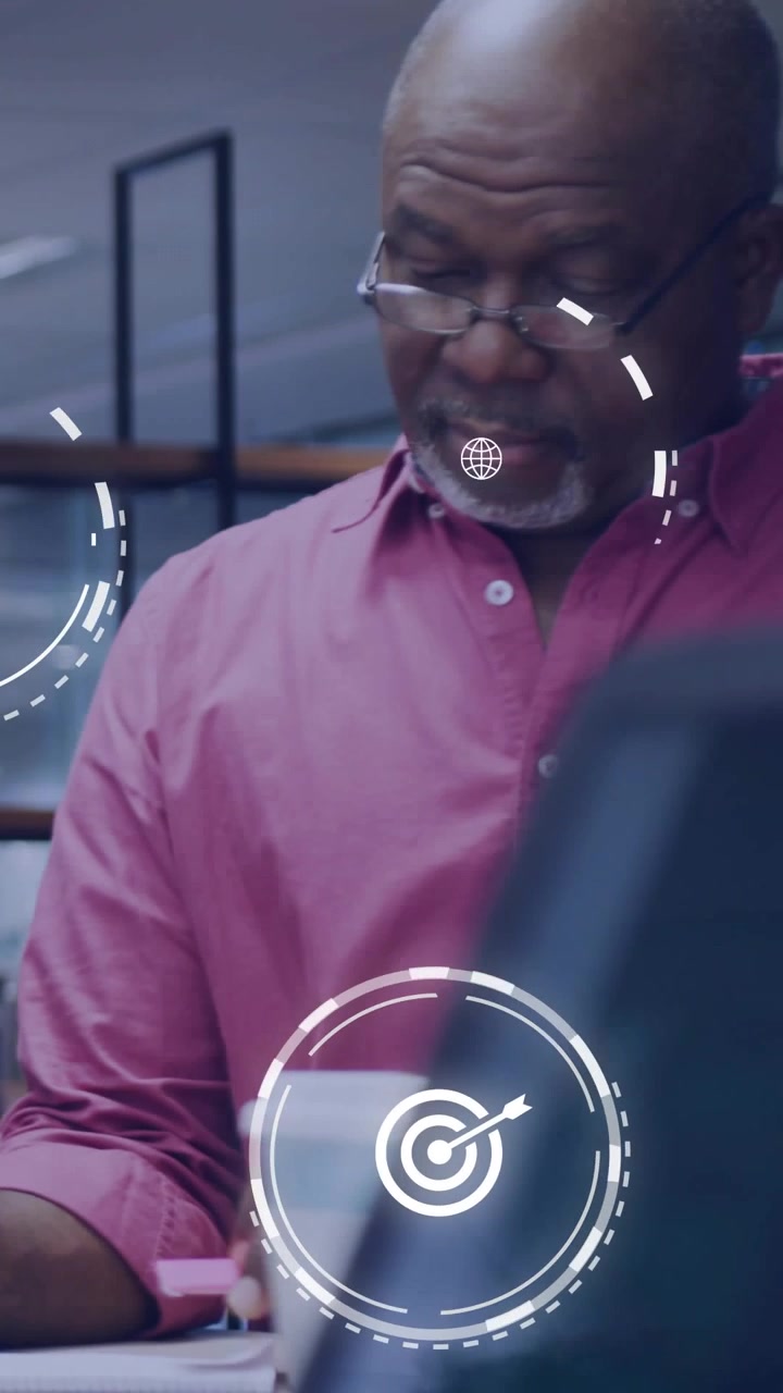 Vertical video: Senior man checking pink note, annotating biz docs for review, HUD moving over face