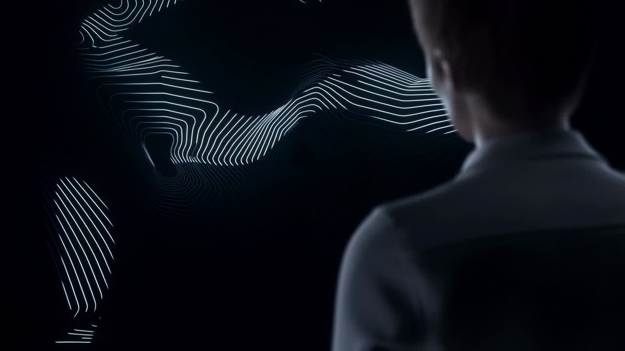 Person observing abstract glowing digital lines in a dark space