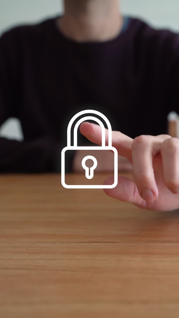 Person Touches Digital Padlock Icon Causing It To Disappear. Security Concept. vertical shot
