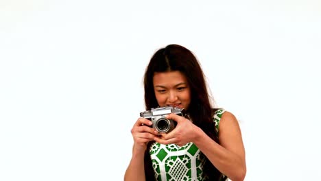 hipster using a retro style camera