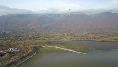 Forward-drone-shot-over-a-lake-in-Greece-during-golden-hour