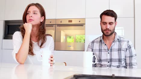 couple not talking after an argument in kitchen