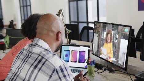 African-american-business-people-on-video-call-with-african-american-female-colleague-on-screen