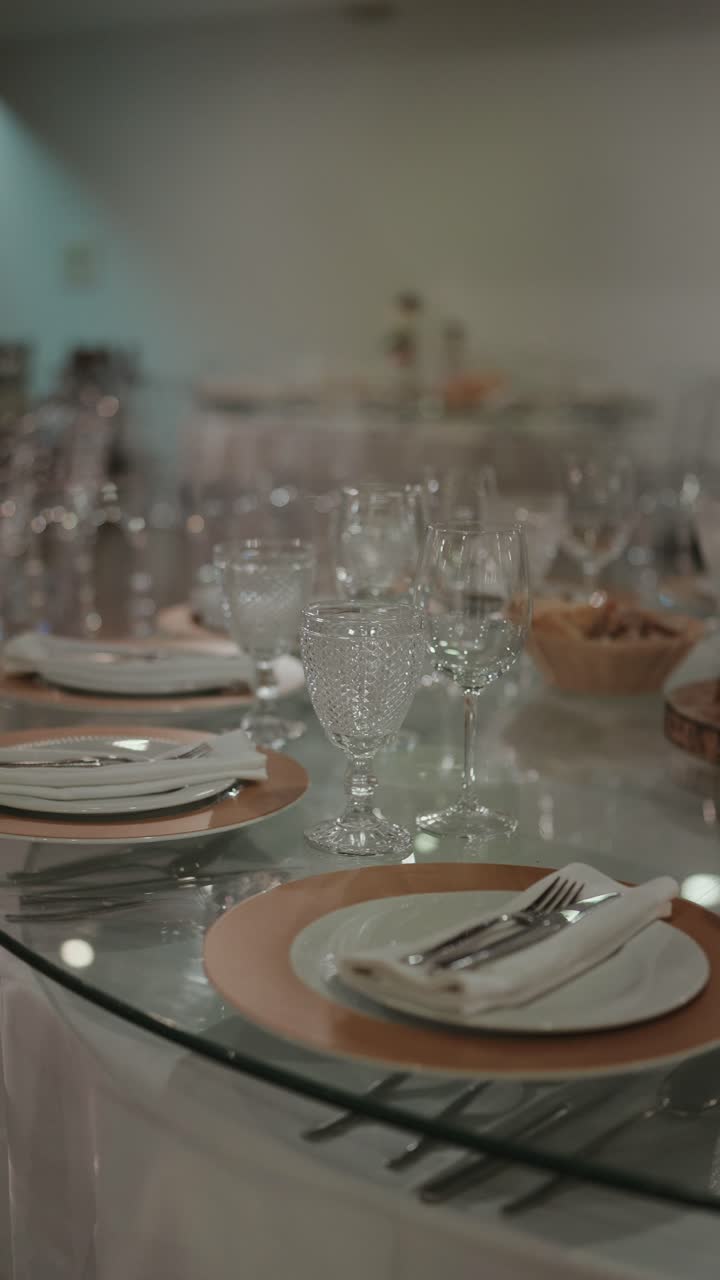 vertical - Dining table set with plates glasses and cutlery for meal