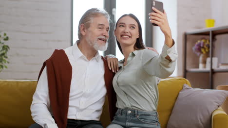 grandparent and grandchild taking selfie