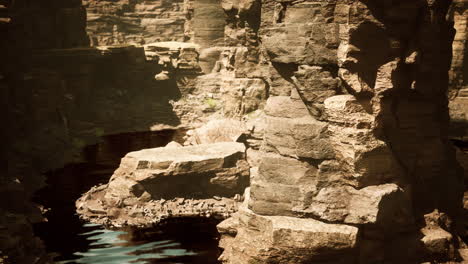 colorado river with gorgeous sandstone walls and canyons