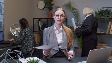 female business company manager at office reading candidate resume unsuccessful job interview