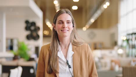 confident associate walks sales aisle, smiling and looking ahead
