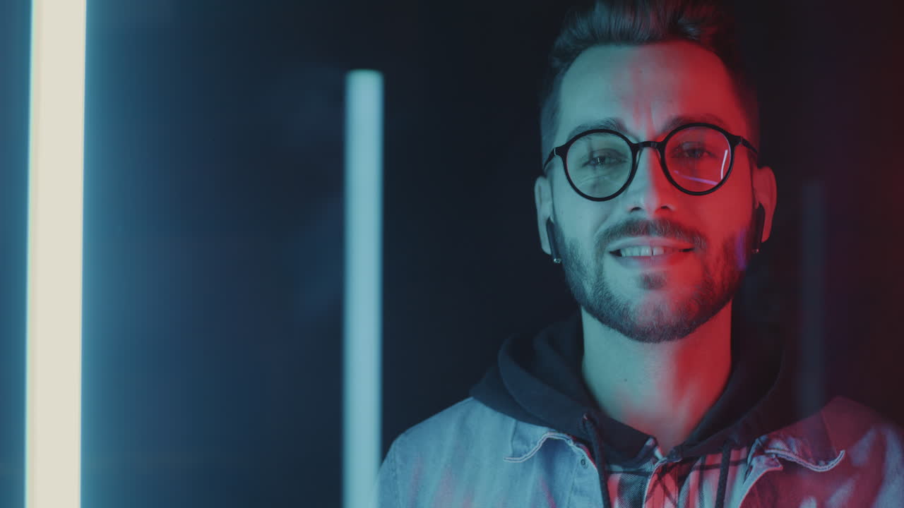 Man Listening to Music in Neon Light