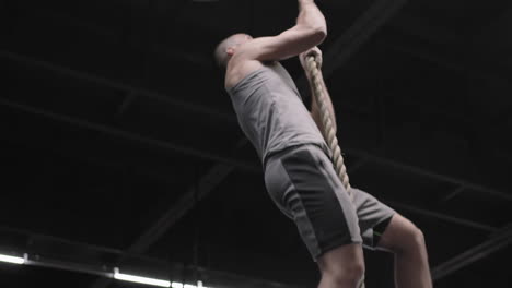 man climbing a tightrope