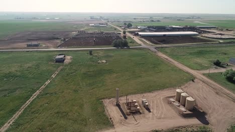 Drone-drifting-over-ranches,-fields-and-dairy-near-a-fracking-site-Weld-County-June-2022