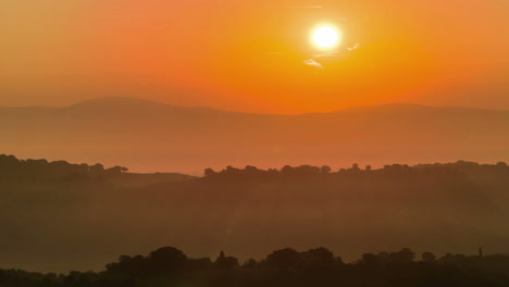 sunrise time lapse over hills and mountains