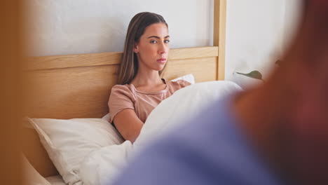 couple, fight and woman on a bed angry with stress