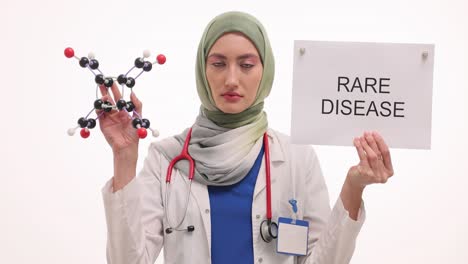 medical professional addressing rare diseases with molecular model