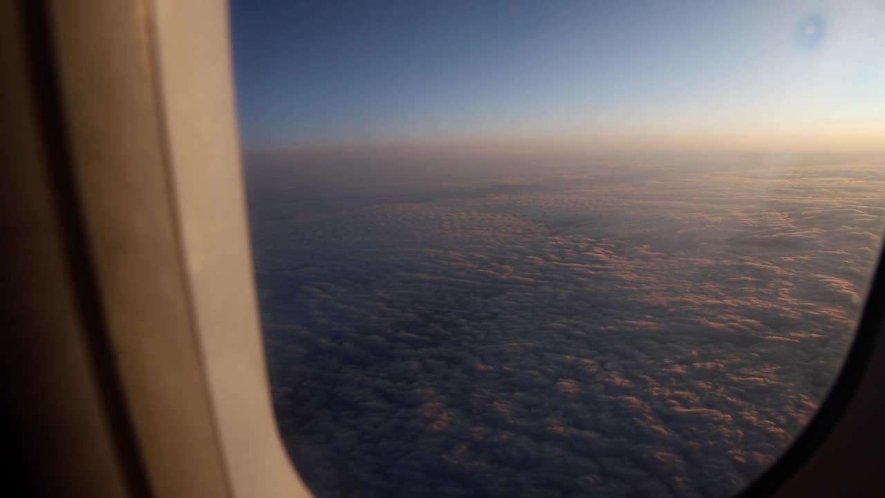Sunset view out a plane window from 35,000 feet, over the plains states in the US
