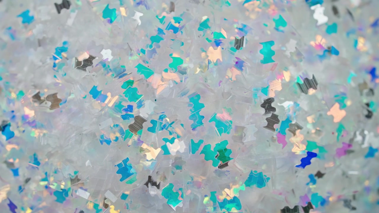 Abstract Background of Shimmering Iridescent Glitter Particles