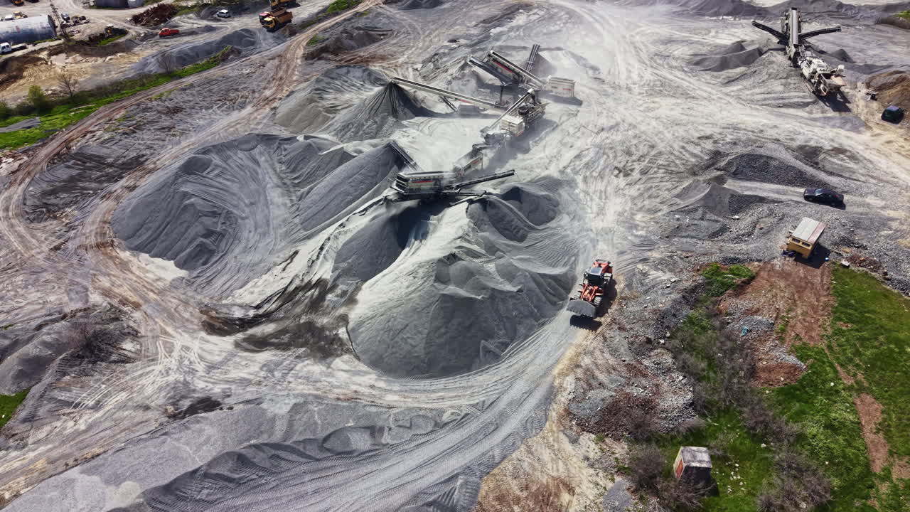 Aerial View of a Large Quarry with Crushing Plant and Heavy Machinery